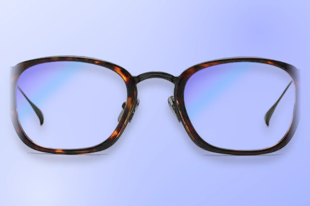 Tortoise frame with anti blue light lenses showing a blue reflection from screen light